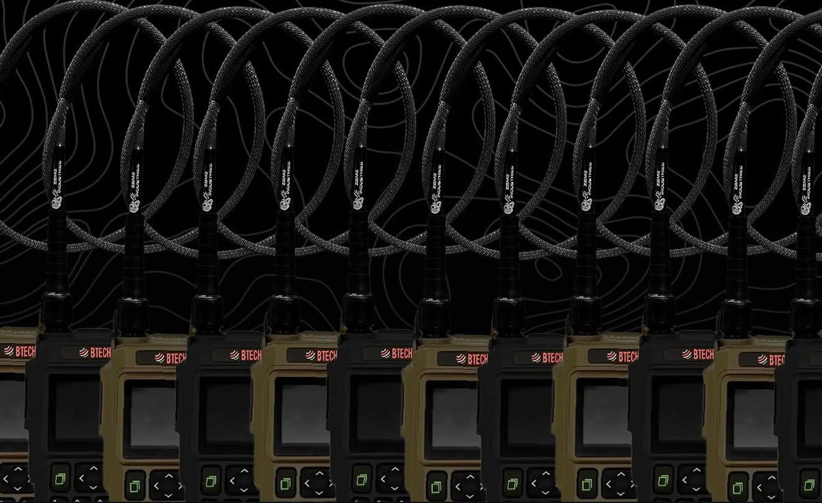 Row of BTECH UV-PRO radios fitted with Foul Weather Whip dual band antennas