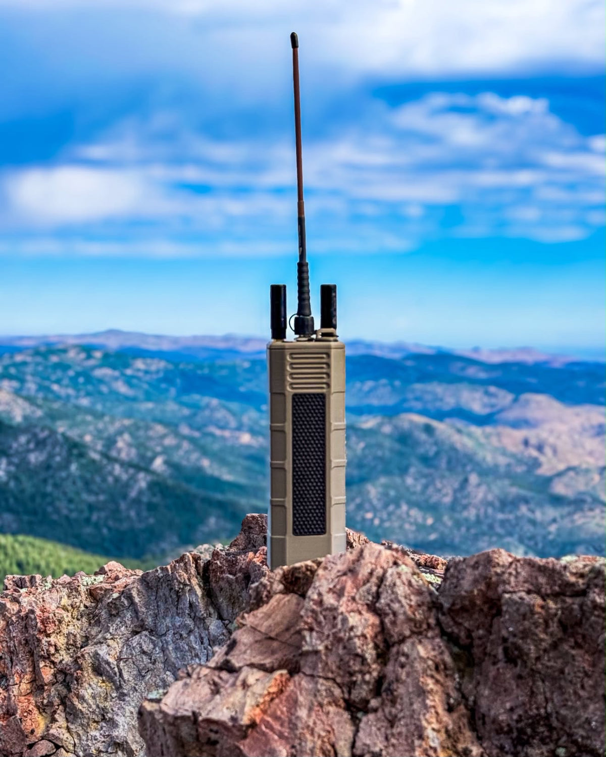 Handheld radio with ZBM2 whip on a mountain summit